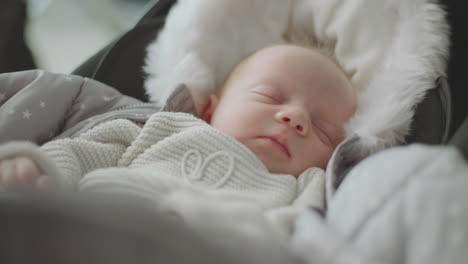 sleeping baby in a stroller