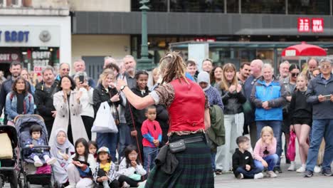 performer entertains crowd with yoyo tricks