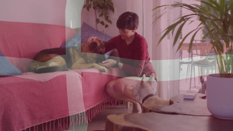 woman petting dog on couch in health app demo, showing animated paw icons and health chart