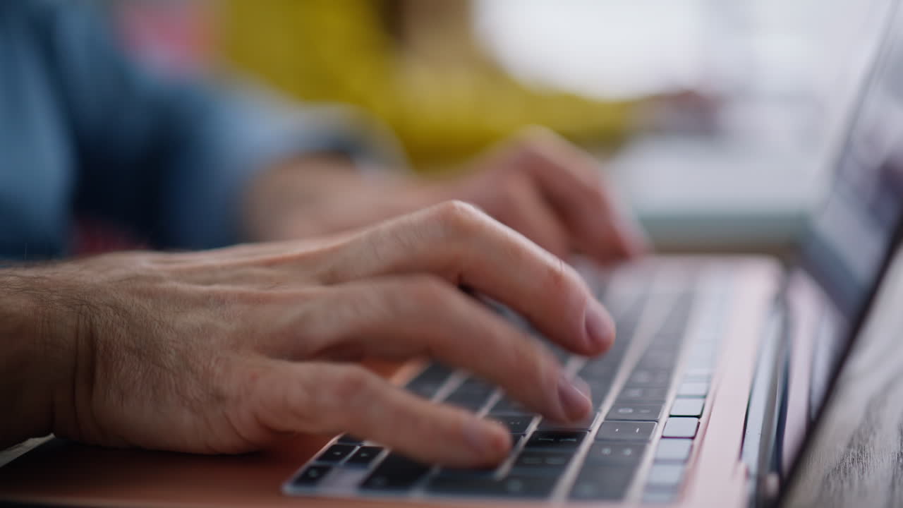 Office team hands typing laptops at coworking space closeup. Colleagues working