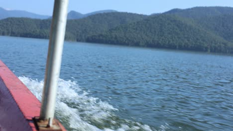 traveling by boat on a calm, scenic lake