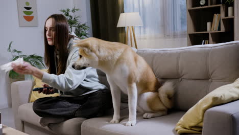 woman sitting next to her dog