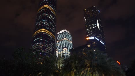 night illuminated guangzhou city downtown skyscrapers crowded park panorama 4k china