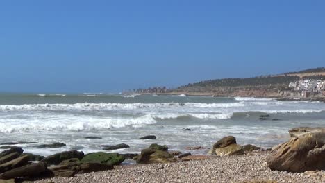 waves arrive at the beach in Taghazout Morocco