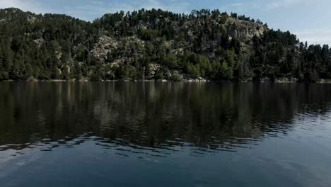 flying above a lake near les bulloses, la cerdanya, catalunya 4k