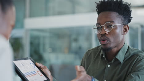 african businessman, talking and tablet with data