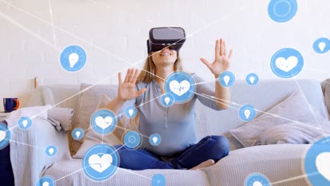 Animation-of-network-of-connections-with-icons-over-woman-wearing-vr-headset