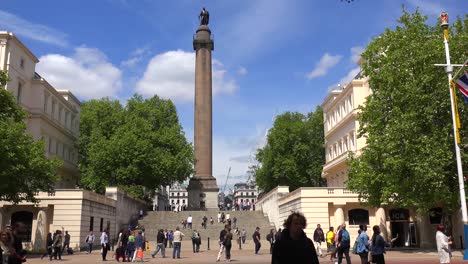 an establishing shot of trafalgar square london england on a sunny day