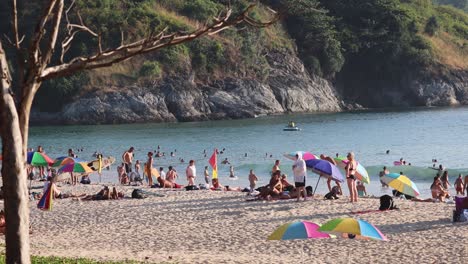 crowded beach scene with active visitors