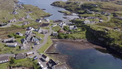 Wide-angle-tilting-drone-shot-of-the-Isle-of-Scalpay,-an-island-near-the-Isles-of-Harris-and-Lewis-on-the-Outer-Hebrides-of-Scotland