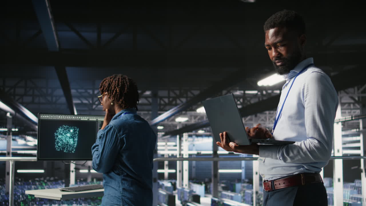 Smiling data center engineering team on industrial platform