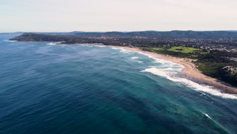 sky drone aerial landscape shot of beautiful coastline headland pacific ocean shelly beach central coast nsw australia 4k