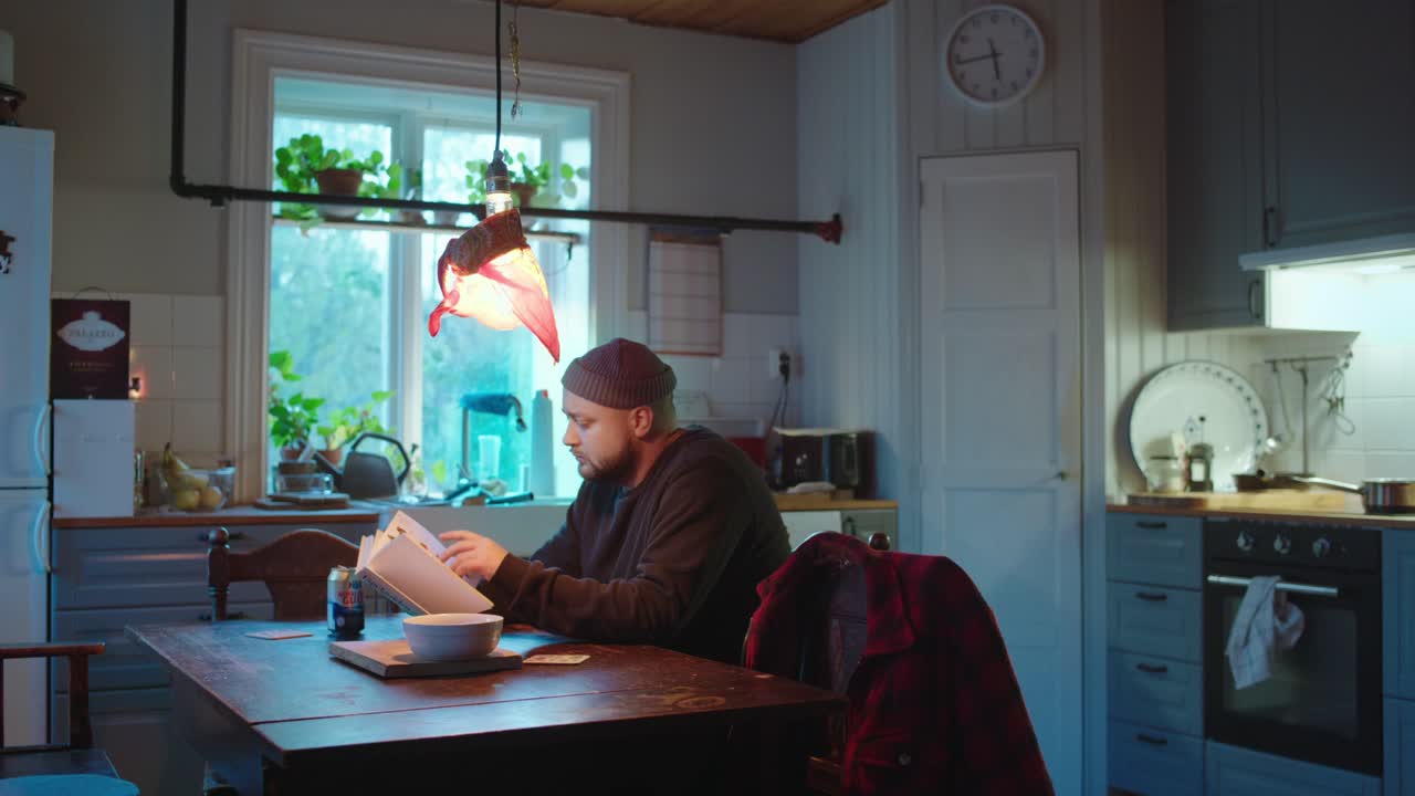 Man Reading a Book in a Cozy Kitchen