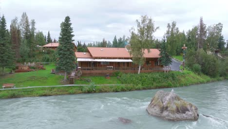 aerial footage a cabin next to the kenai river in alaska