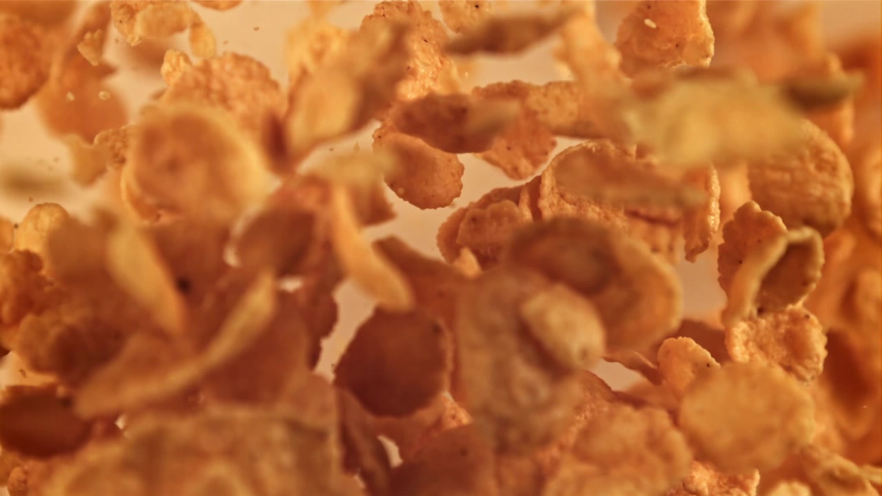 Golden Cornflakes Falling in Slow Motion
