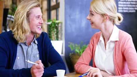 Man-and-woman-discussing-with-each-other