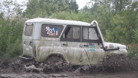 off-road vehicle in muddy terrain