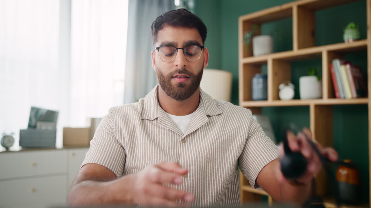 Man with Headache in Home Office