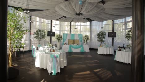 elegant wedding reception in a glass-enclosed venue