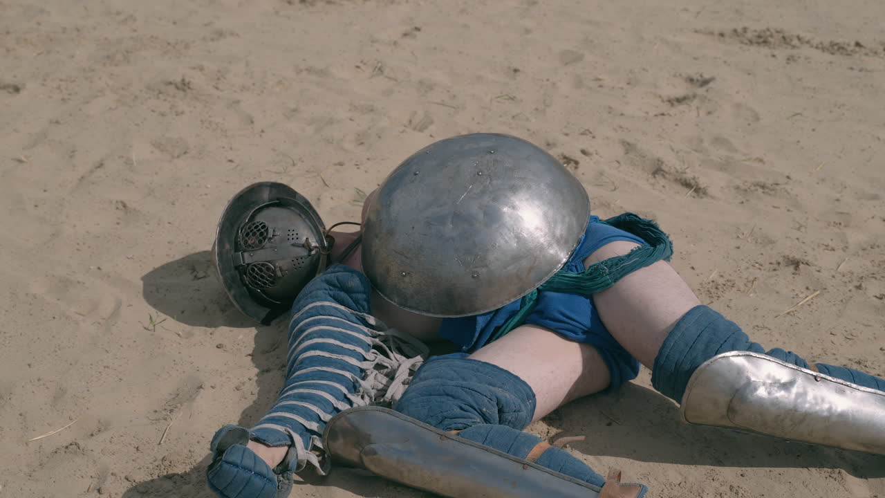 Medieval Combatant Fallen in Sand