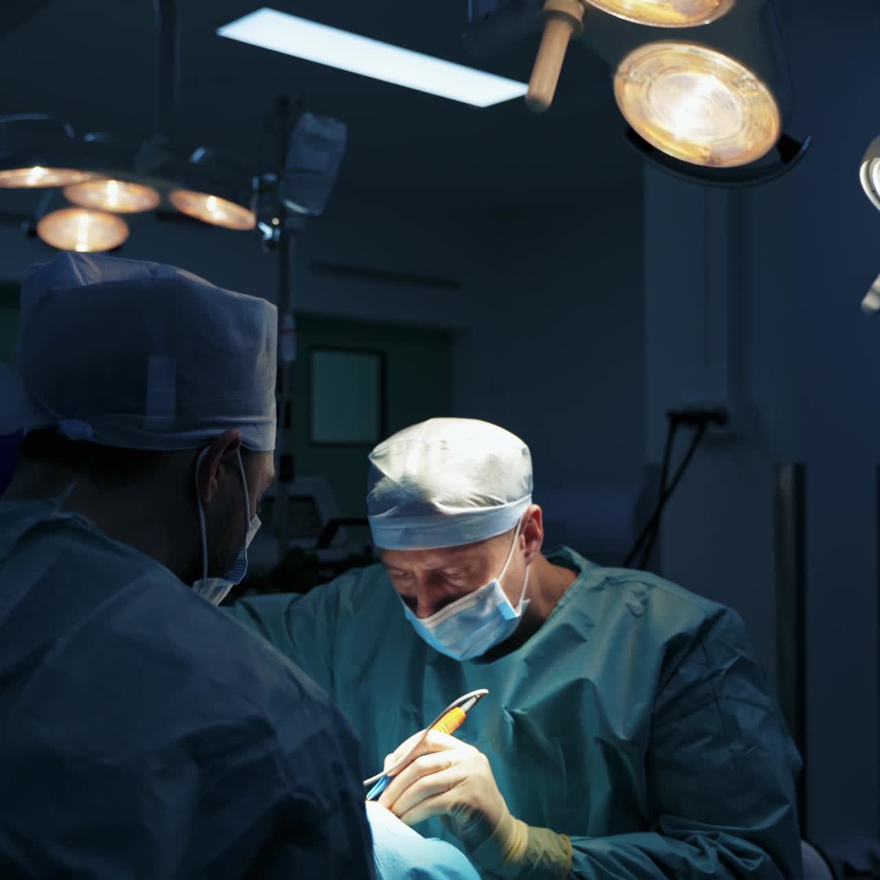 Operation for modifying the eye region of the face in medical clinic. Doctors do plastic cosmetic operation for a patient. Blepharoplasty plastic surgery.