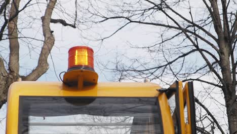 yellow vehicle with warning light