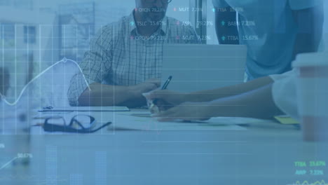 animation of financial data processing over diverse business people using laptop