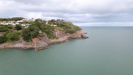 Rocky-Ocean-Coast-of-the-Seaside-Resort-Town-of-Torquay,-England---Aerial