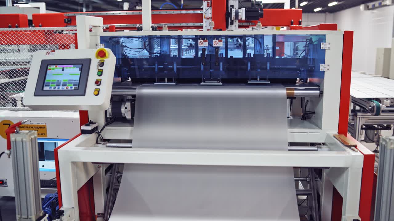 Closeup of special machinery at solar production panels factory. Industrial technic at plant. Modern green energy production.