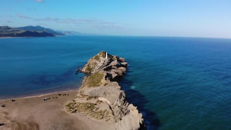 beautiful coastal scenery of tall lighthouse on a rocky reef