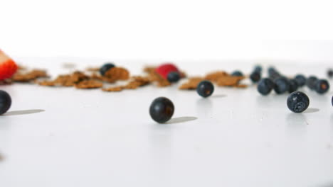 wheat cereals and red berries rolling