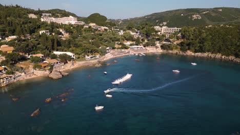 Tour-boat-weaves-between-vessels-to-park-and-anchor-in-bay-of-Corfu-Greece