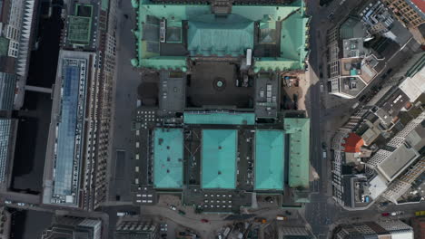 Slow-aerial-birds-eye-overhead-view-of-Hamburg-city-hall-green-rooftop