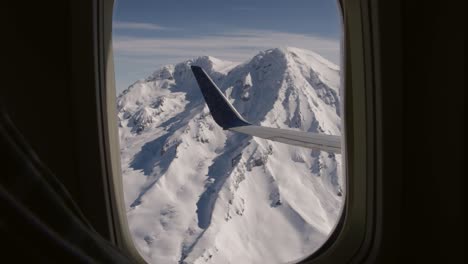 Airplane-commercial-jet-passenger-view-out-of-a-coach-window-of-Mt