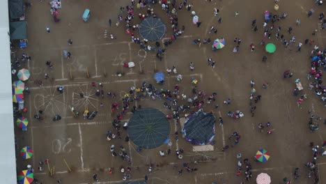 flying above all saint's day in sumpango during cloudy day, aerial