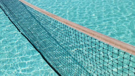 water surface texture, slow motion clean swimming pool ripples and wave, refraction of sunlight top view texture sea side white sand, sun shine water background. water caustic background