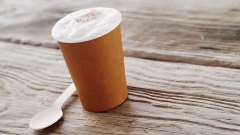 Coffee-cup-on-wooden-plank