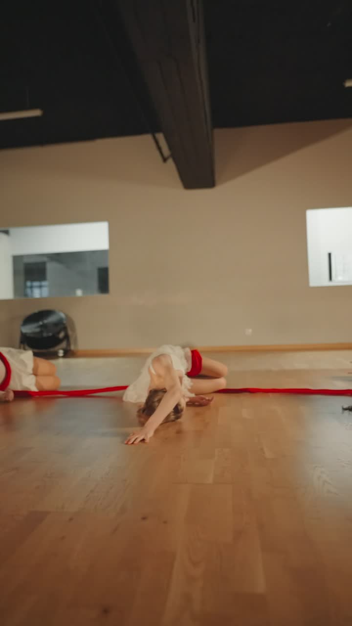 Contemporary Dance Performance with Red Ribbons