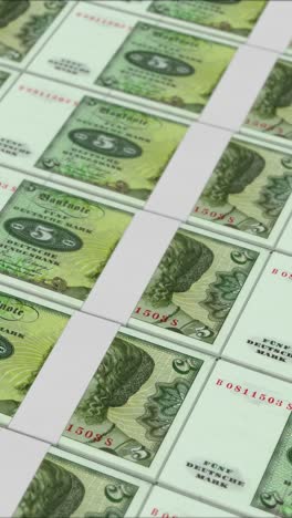 vertical video of 5 deutsche mark germany banknotes printing by a money press