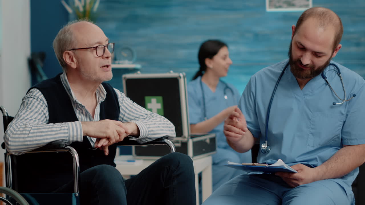 Patient with disability doing consultation with man nurse