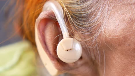 hearing aid on elderly person