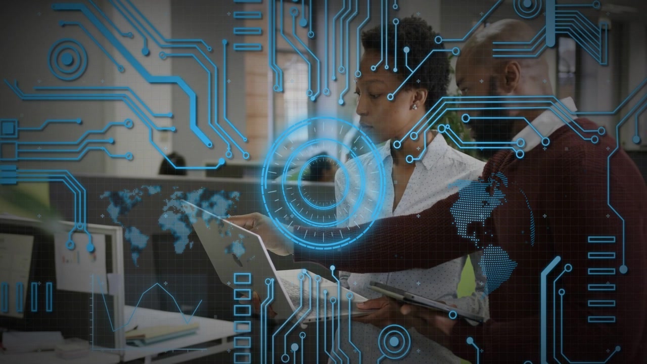 Man consulting tablet and pointing to woman holding laptop, blue HUD overlay fading in showing data