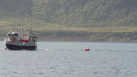 Fishing-Boat-Cruising-In-The-Island-Of-Husoya-In-Nordland,-Norway
