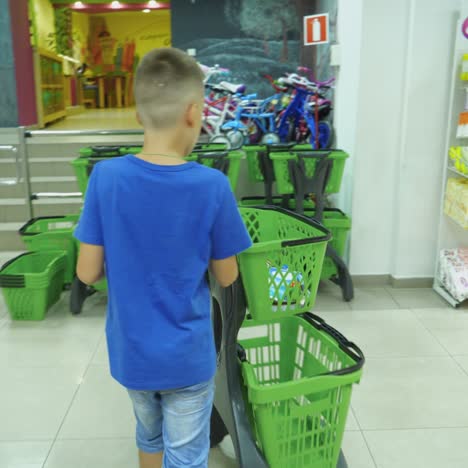 vinnitsa, ukraine - august 20, 2018: back to school. boy choosing school stationery at the supermarket.