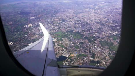 incredible aerial view of the jakarta cityscape from the window seat of an airplane