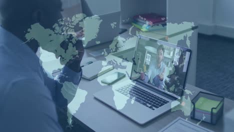 animation of world map over african american businessman having video call