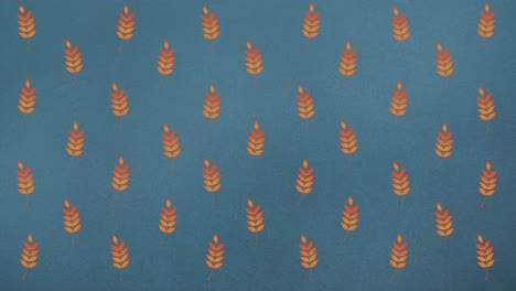 Animation-of-rows-of-autumn-orange-leaves-on-blue-background