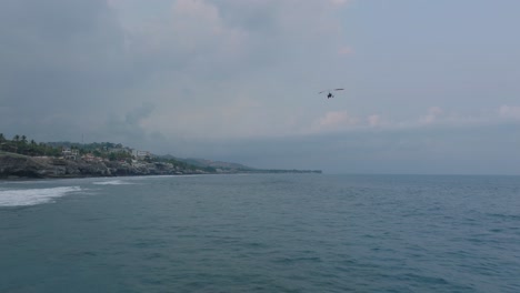 Aerial-Drone-View-Of-Hanglider-At-Sunset-El-Tunco-El-Salvador