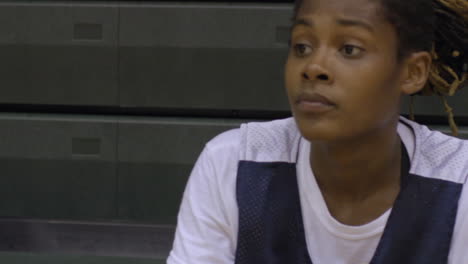 woman pro basketball player takes a break at practice