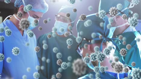 Animation-of-3d-covid-19-cells-floating-over-doctors-wearing-face-masks